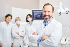 smiling dental team inside their charitable modern practice